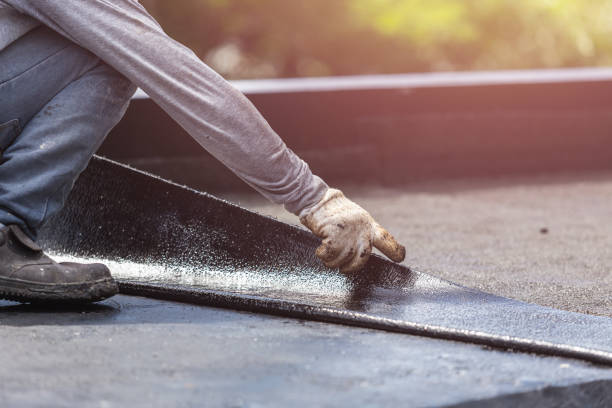 Professional Interior Drainage System technician working in Bayville, NY